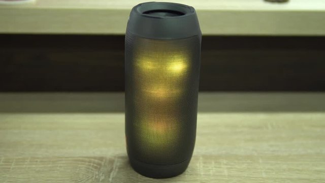 Portable speaker glows.