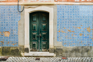 Fototapeta na wymiar Broken vintage blue Portuguese azulejo tiles in Tomar, Portugal
