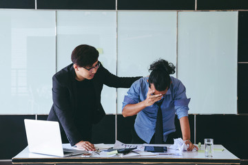 Businessman comforting their shoulders.Businessman encourage concept.