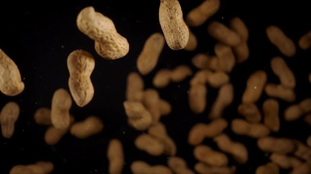 Peanuts frozen in mid-air. Shooted in super slow motion