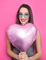 Young brunette with ballon