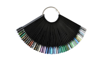 Nail polish samples close up on a white background, colorful nail polish on a black tips in rainbow, violet, lilac, purple, pink, turquoise, green, glitter, holographic; nail salon advertising