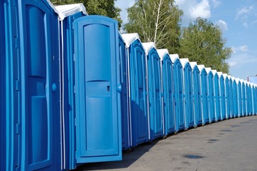 A line of portable toilets.