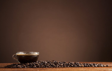 Coffee on a brown background with copy space