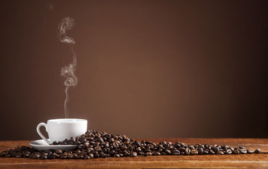 Coffee on a brown background with copy space