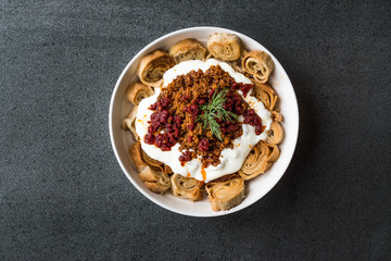 Turkish Manti with Yogurt, Minced Meat and Fried Butter Sauce From Artvin called Silor / Siron / Ziron Rolled Raw Dough and Fried Phyllo / Manlama