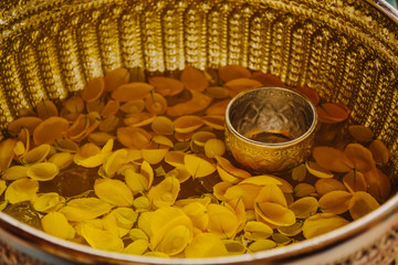Thai silver bowl with flowers floating in water for every festival in Thailand.