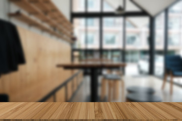 cafe coffee shop cafeteria blur background with wood table for display product