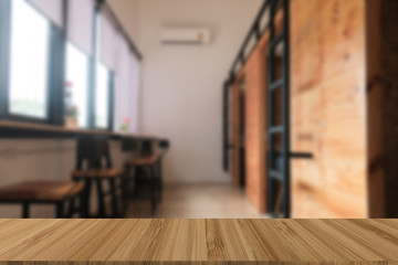 cafe coffee shop cafeteria blur background with wood table for display product