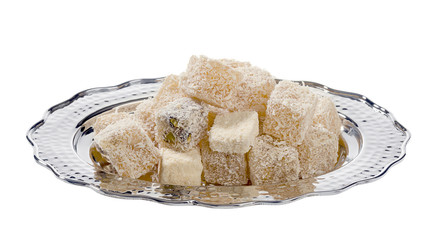 Traditional Turkish delight in vintage plate isolated on white background.      
