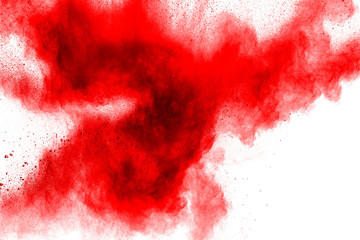 abstract red dust splattered on  white background. Red powder explosion.Freeze motion of red...
