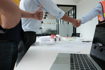 architect & customer shaking hands. Engineer handshaking with partner for successful deal in building project development. business teamwork concept