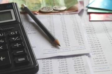 Financial accounting. Pencil and calculator on business report