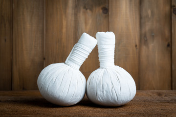 herbal compress balls on wood