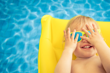 Funny baby boy on summer vacation