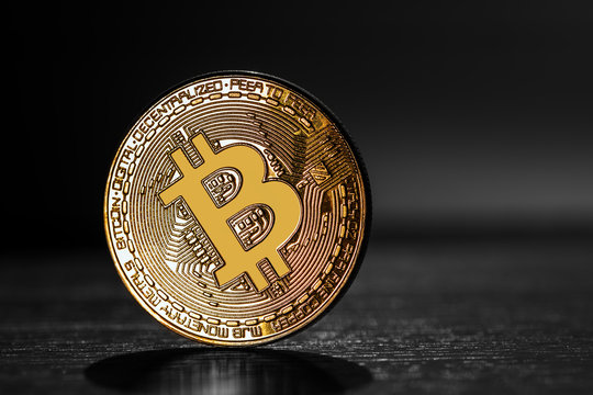 golden bitcoin on the black background