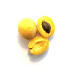 Three appetizing apricots on a white background. Top view.