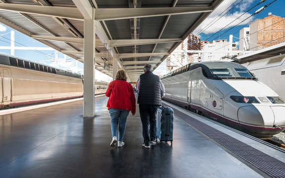 Senior couple  on the railway platform goes on a trip