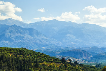 Fototapeta na wymiar Green hills and mountains on the Greek island of Crete in Chania region on a beautiful sunny day