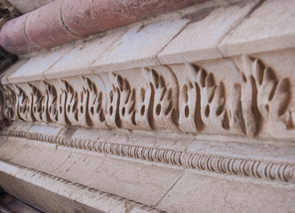 Particular decoration of the main door of the Annunciation Cathedral in Popolo square of Todi