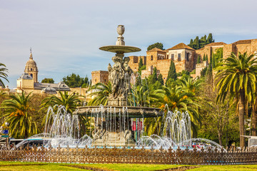 Malaga, Spain: Fountain and Alcazaba fortress.