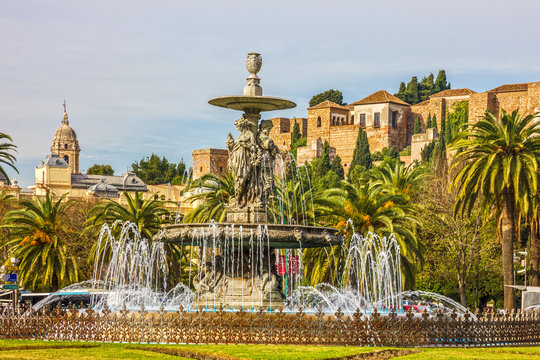 Malaga, Spain: Fountain and Alcazaba fortress.