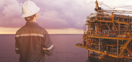 Double exposure of Engineer or Technician man with safety helmet operated platform or plant by...