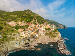 Fototapeta na wymiar Manarola - Village of Cinque Terre National Park at Coast of Italy. Province of La Spezia, Liguria, in the north of Italy - Aerial View - Travel destination and attractions in Europe.
