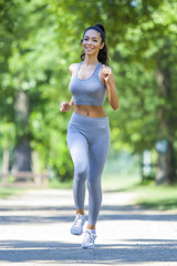 Young fit beautiful girl running outdoor