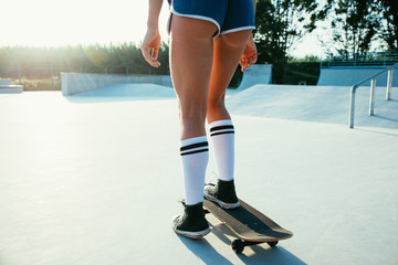 Beautiful skater girl lifestyle moments in a skatepark