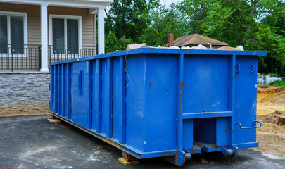 Full construction waste debris a building container, garbage bricks and material from demolished...