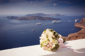Bridal wedding bouquet of flowers on wedding day on Santorini