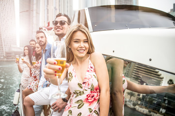 Group of friends making party on a yacht in Dubai