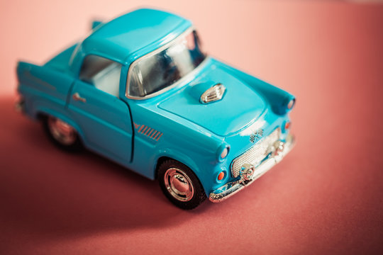 Blue Toy Car On Red Backgroud