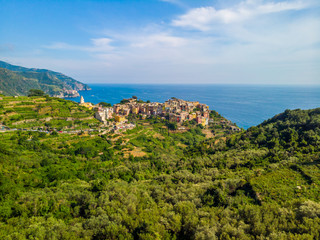 Fototapeta na wymiar Corniglia - Village of Cinque Terre National Park at Coast of Italy. Province of La Spezia, Liguria, in the north of Italy - Aerial View - Travel destination and attractions in Europe.