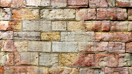 Old weathered brick wall as background or texture