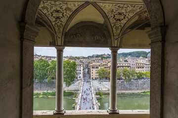 View of people walk on St Angel Bridge from Castel Sant'Angelo in Rome city
