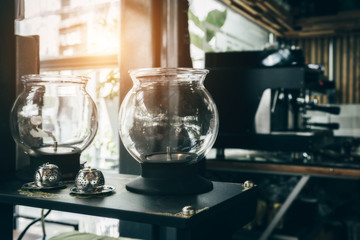 Hipster looking coffee shop and tidy counter and well-maintained shiny coffee machine