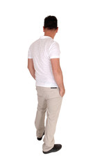 Fototapeta premium Man standing relaxed in casual clothing from the back