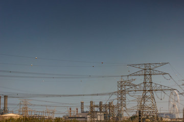 Power pylons and high voltage lines. On a sky background a power line.