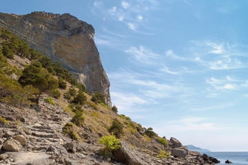 Fototapeta na wymiar Steps on the trekking trail, laid in the coastal cliffs, along the sea.Crimea.