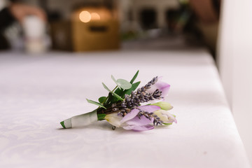 The groom's buttonhole from fresh flowers. Groom's accessory.