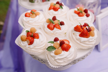 Beautiful strawberry cakes. Tasty candy stores a product from cream and strawberry.