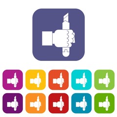 Hand hoding construction utility knife icons set vector illustration in flat style In colors red, blue, green and other