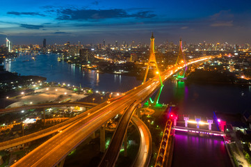 Fototapeta na wymiar Bangkok Expressway top view, Top view over the highway,expressway and motorway at night, Aerial view interchange of a city, Shot from drone, Expressway is an important infrastructure in Thailand