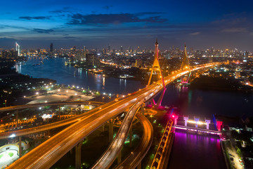 Fototapeta na wymiar Bangkok Expressway top view, Top view over the highway,expressway and motorway at night, Aerial view interchange of a city, Expressway is an important infrastructure in Thailand