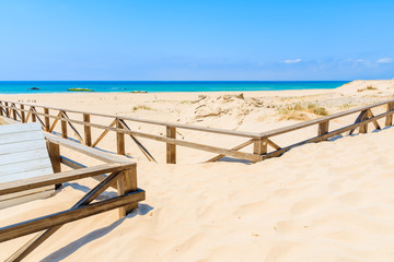 Walkway to Tarifa beach with azure ocean water, Costa de la Luz, Spain