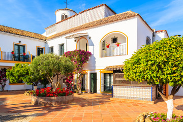 Square with typical white houses in small village near Marbella. Andalusia, Spain