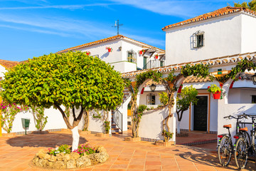 Square with typical white houses in small village near Marbella. Andalusia, Spain