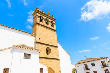 Fototapeta premium White facade and tower of church building in Andalusian village of Ronda, Spain